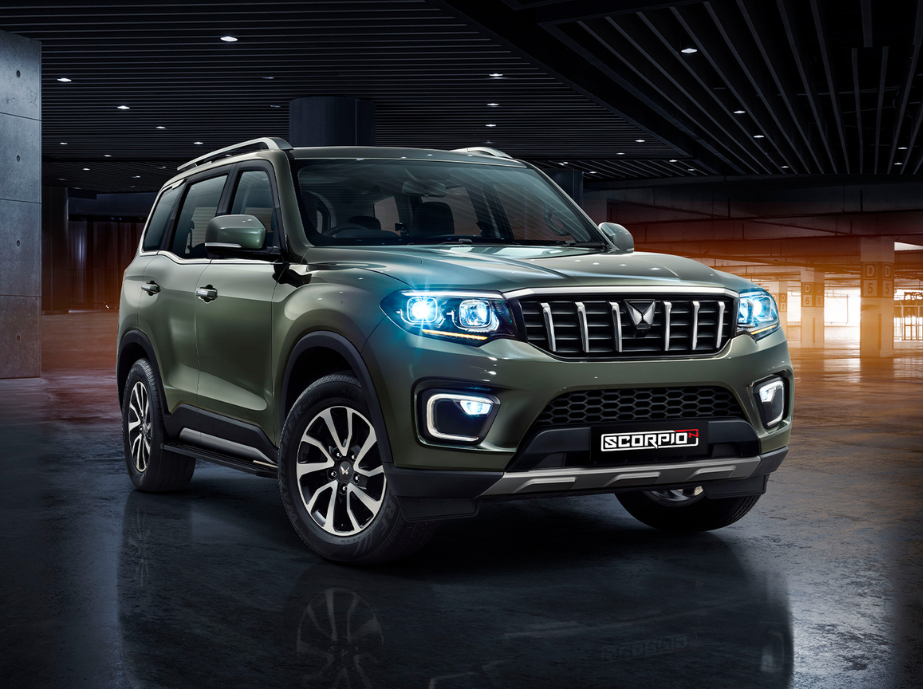 Business handshake over car